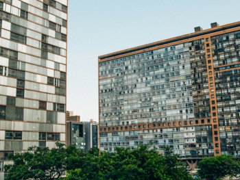a couple of tall buildings sitting next to each other